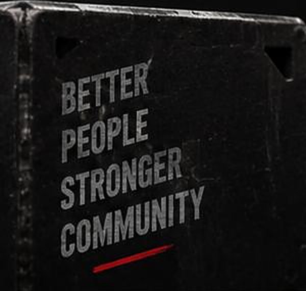 Plyo box painted with Better people, stronger community